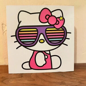 White Hello Kitty wooden wall hanging. 5x5". Adorable image of Hello Kitty! NEW!
